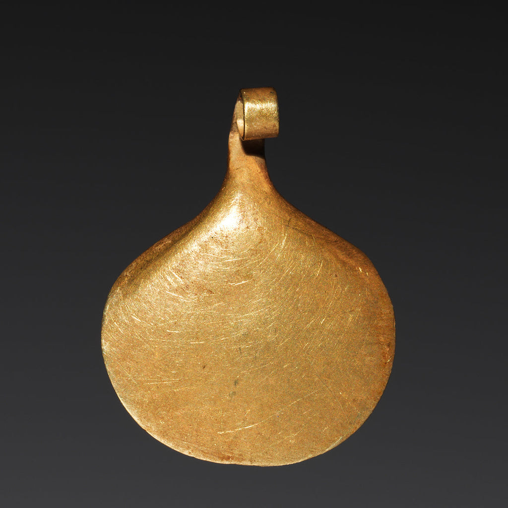 A gold bead or pendant in the shape of an oyster shell from ancient Egypt in the Cleveland Museum of Art