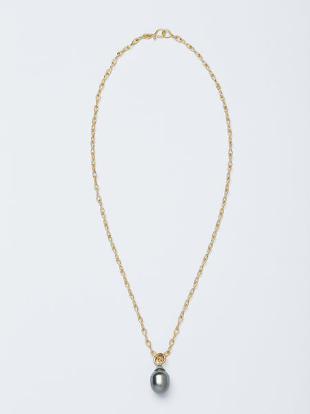 A necklace handmade by Alexis Menten with a gray South Sea pearl pendant resembling an ancient amphora shown from the front