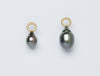 Two pendants handmade by Alexis Menten with gray South Sea pearls that resemble ancient amphora shown from the side