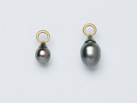 Two pendants handmade by Alexis Menten with gray South Sea pearls that resemble ancient amphora shown from the side