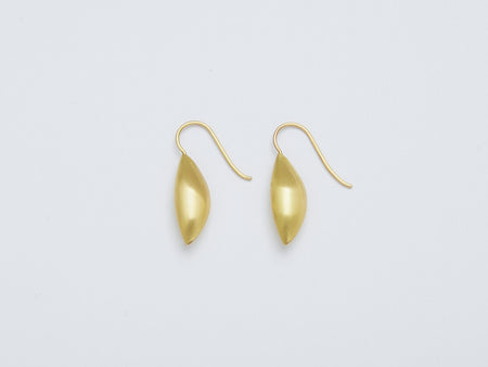 Cylichna Earrings by Alexis Menten with 22k gold cylinders with tapered ends handmade in an ancient style shown from the side