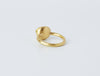 Hellenistic Ring by Alexis Menten handmade in an ancient style with 22k gold and an emerald showing the curved back