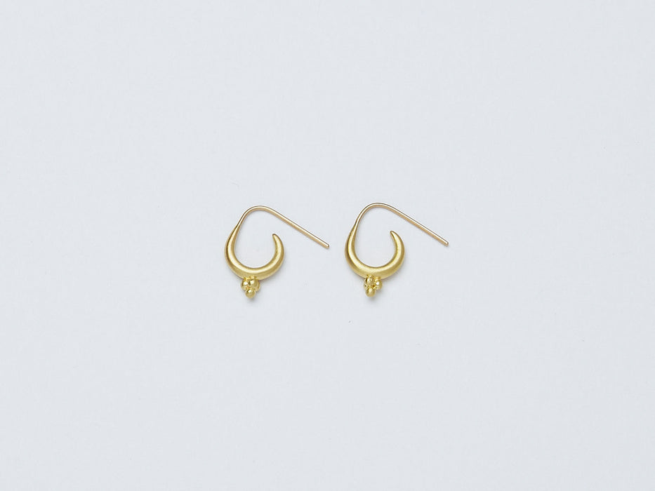 Mari Earrings handmade by Alexis Menten with 22k gold ancient style crescent hoops and granules shown from the side