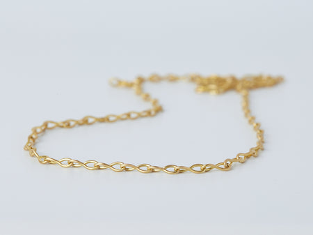 Nuru Chain by Alexis Menten with 20k gold twisted figure-of-eight links handmade in an ancient style shown close up