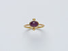 Satnal Ring by Alexis Menten handmade in an ancient style with 22k gold, a ruby, and two granules shown from the front