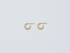 Selene Earrings by Alexis Menten with 22k gold crescent hoops handmade in an ancient style shown from the side