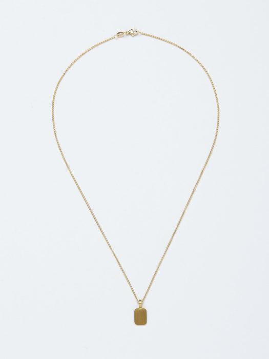 Stele Necklace by Alexis Menten with a rectangular 22k gold pendant handmade in an ancient style shown from the front